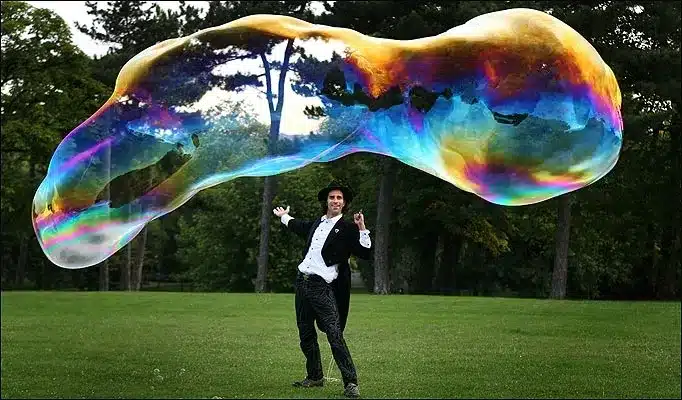Magician makes a huge bubble